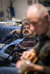 Drummer Jeff Franks listening to Tyler play a guitar track.